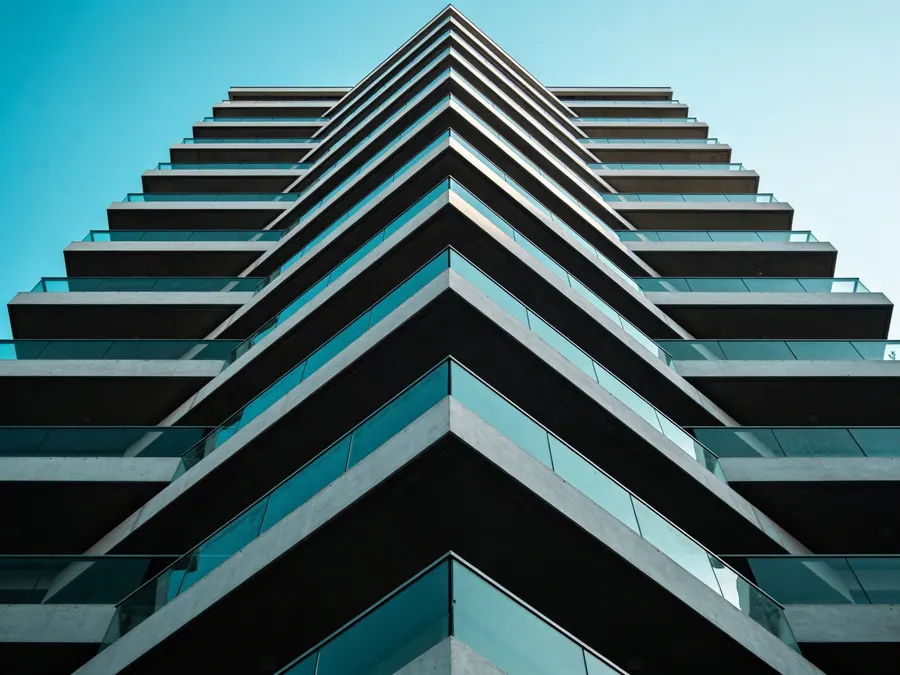 A modern Israeli residential tower seen from below